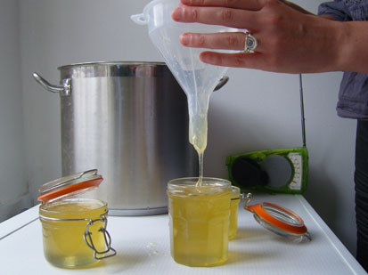 Photo of honey being poured into jars