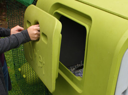 Image of the Eglu Cube's Eggport being opened