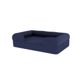 Ein dunkelblaues memory-foam-hundebett mit nackenrolle.