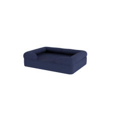 Ein dunkelblaues memory-foam-hundebett mit nackenrolle.