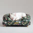 Eine französische bulldogge schläft im midnight meadow nackenrollen-hundebett